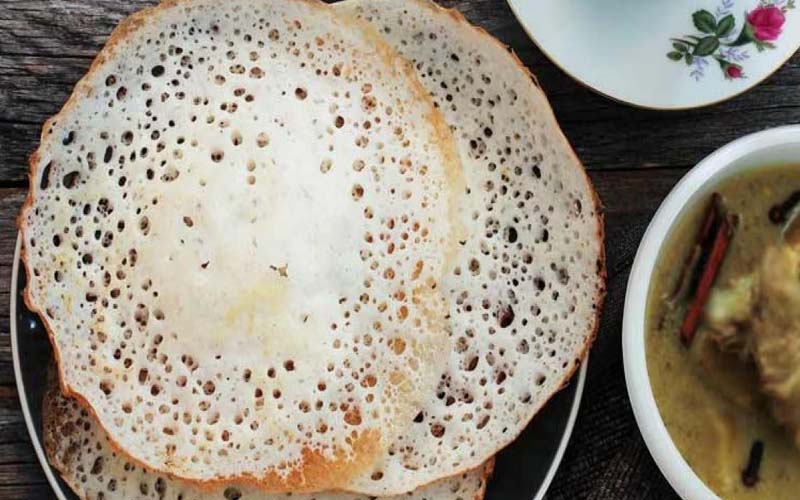 Morning Breakfast Cruise on Kannur Houseboat with guests enjoying Kerala backwaters and traditional cuisine